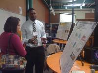 Photo of two researchers during a scientific poster presentation